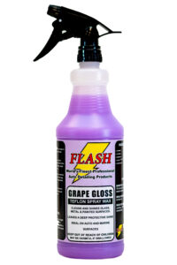 A purple spray bottle of Flash grape gloss cleaner.