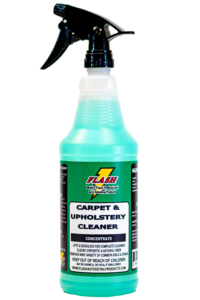 A bottle of blue carpet and upholstery cleaner with a spray nozzle.