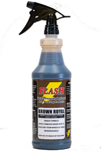 A bottle of Flash Brown Royal soy sauce with a black cap.